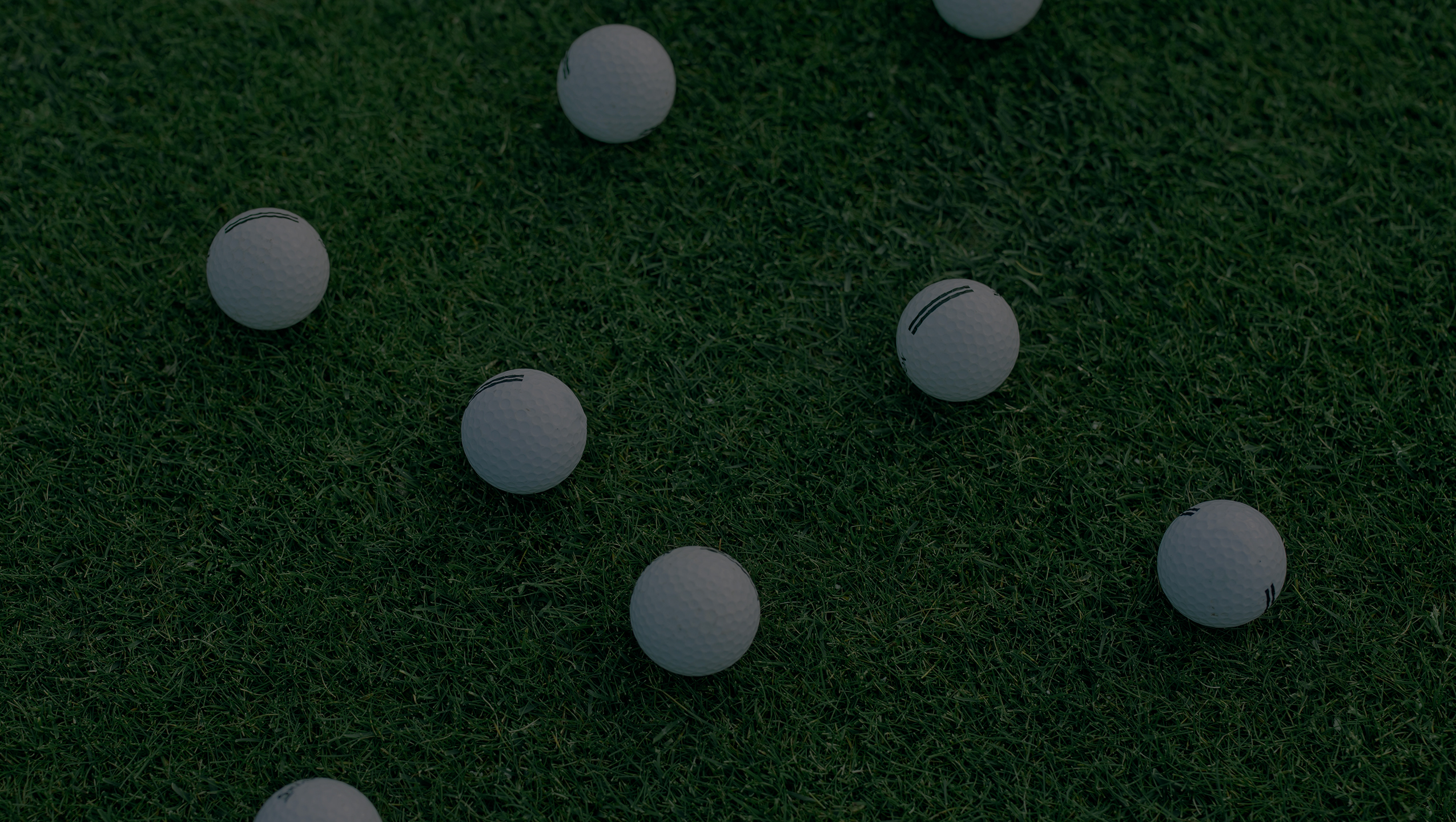 Golfer with golf glove holding white golf ball