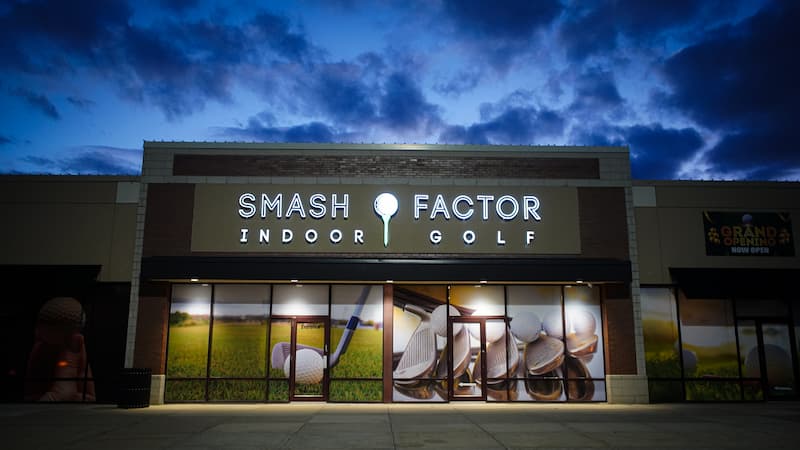 Smash Factor Indoor Golf business from outside with golf ball and tee logo